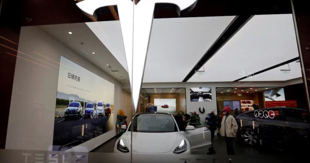 visitors check a tesla model 3 car next to a model y displayed at a showroom of the u.s. electric vehicle (ev) maker in beijing, china february 4, 2023. reutersflorence lofile photo